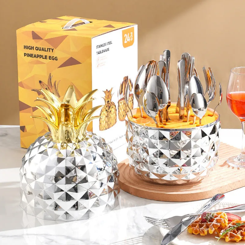 Fashion stainless steel 24-piece tableware set with mirror polish and pineapple egg design in gold finish on a dining table