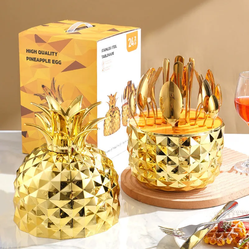 Fashion stainless steel 24-piece tableware set with mirror polish and pineapple egg design in gold finish on a dining table