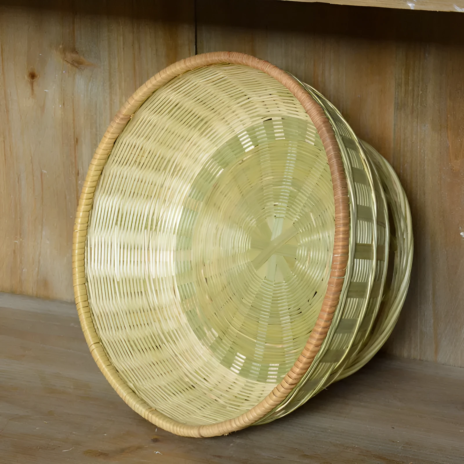 Handmade woven bamboo storage basket showing traditional craftsmanship and three size variations