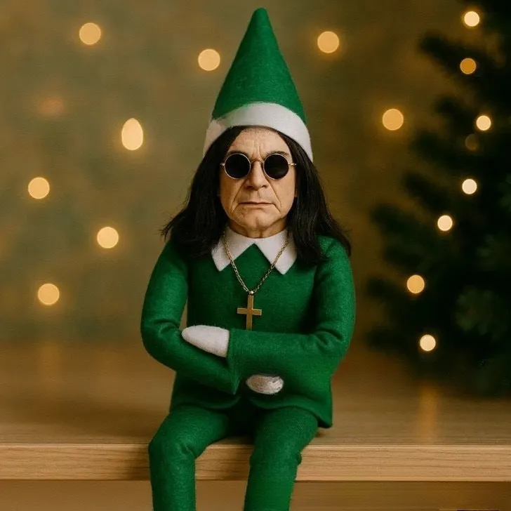 Resin Christmas Oz doll elf decoration in red, 16cm tall, on a shelf