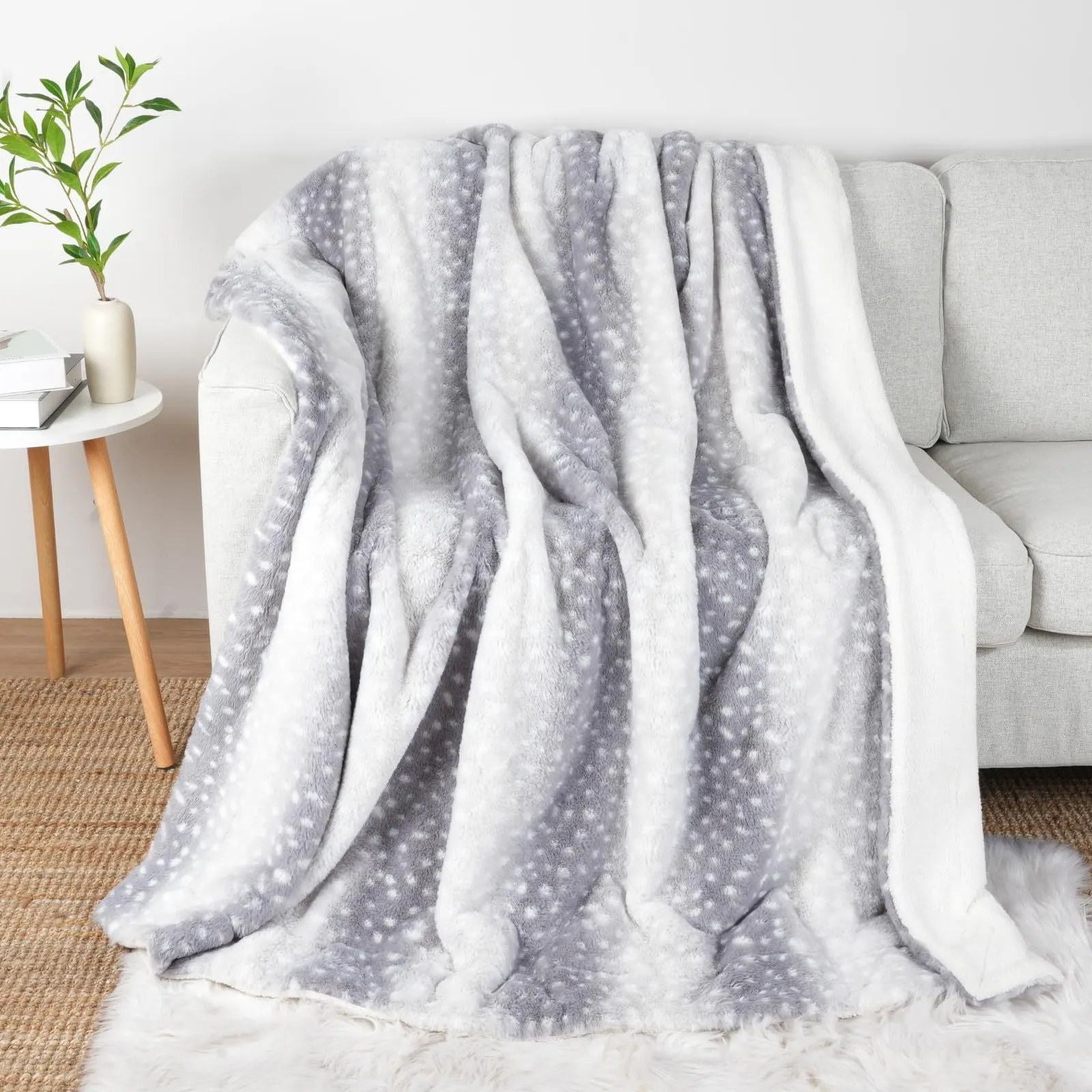 White flannel blanket with animal stripe pattern on a sofa