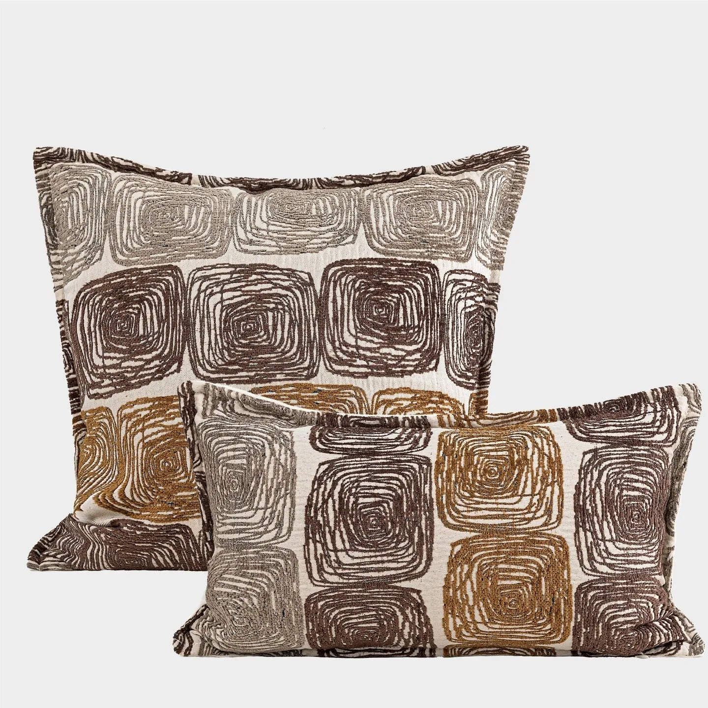 Cream and coffee coloured abstract coil pattern pillow cover shown in square and waist pillow sizes.