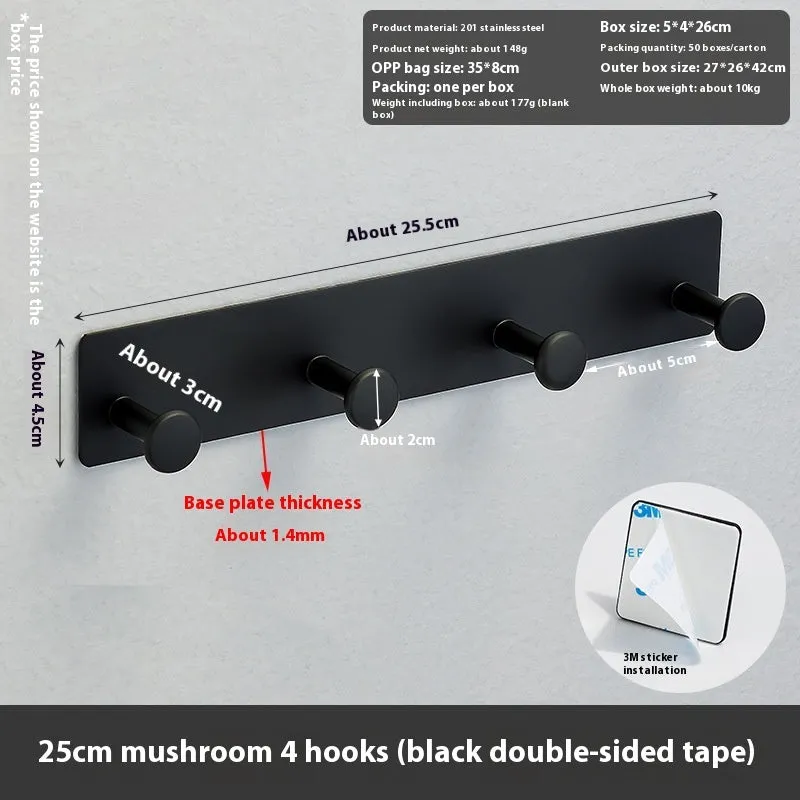 Black screwless adhesive wall hook with three hooks mounted on a glass shower door