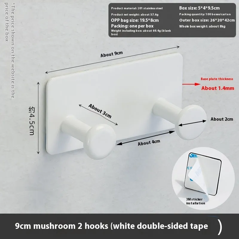 Black screwless adhesive wall hook with three hooks mounted on a glass shower door
