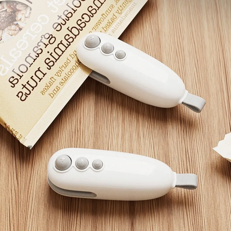 Mini automatic electric thermal sealing machine in ivory white with USB cable, ABS body, 12.2cm length