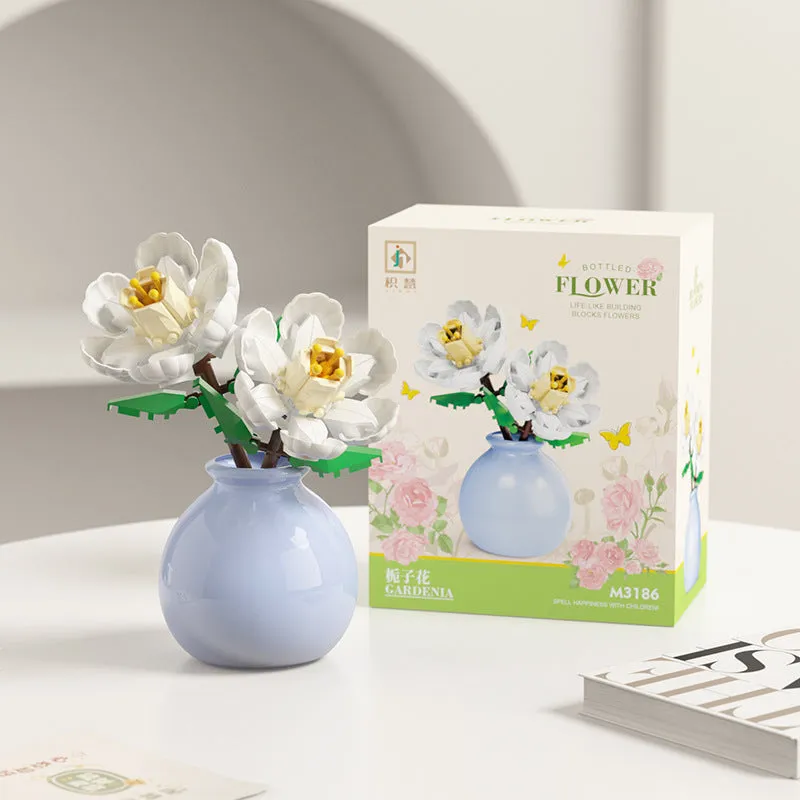 Assembled plastic building block flower in vase on tabletop