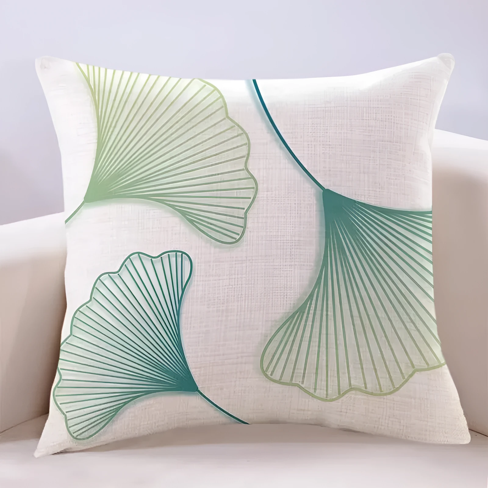 Ginkgo leaf printed square cushion cover on a sofa, available in multiple colours and sizes