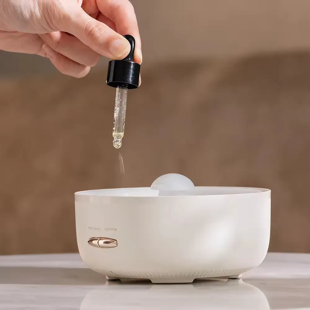 Round resin aroma diffuser with colourful light on a bedroom desktop, beige colour, plug-in humidifier