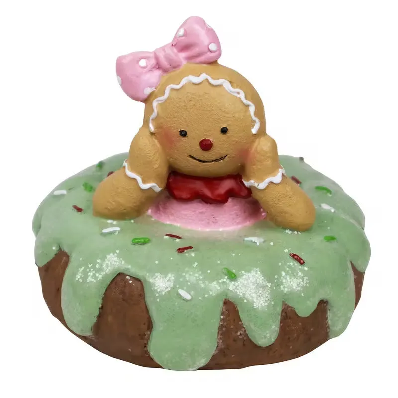 Hand drawn cartoon resin Christmas gingerbread man ornament with green bow design on white background