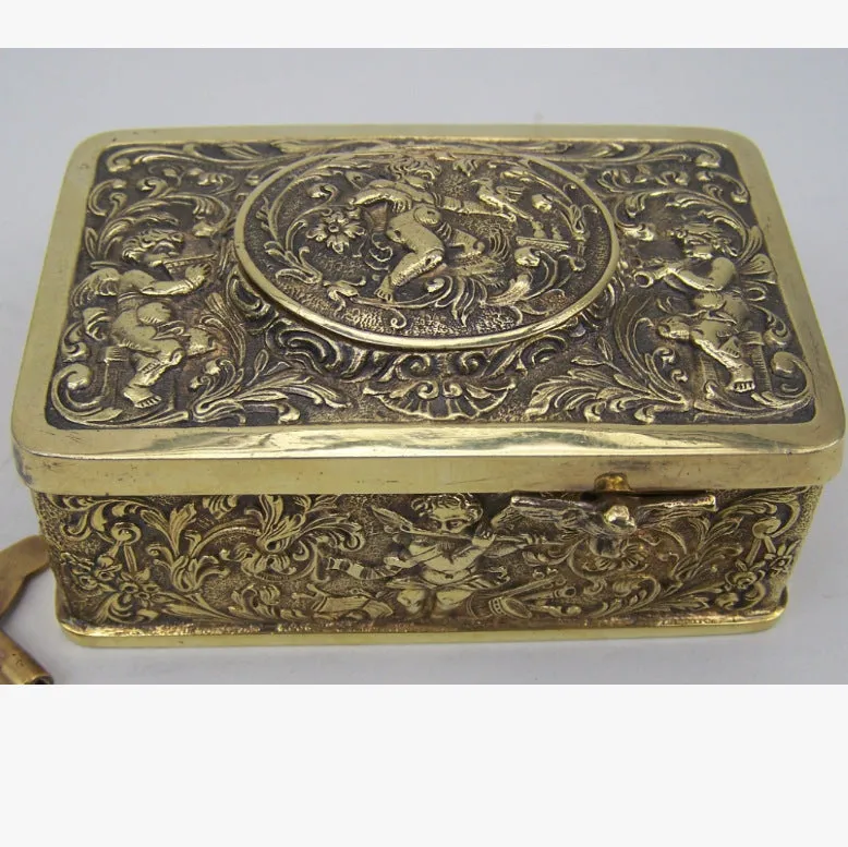 Gold alloy automatic pop-up bird box decoration on a tabletop, 10x6x4 cm