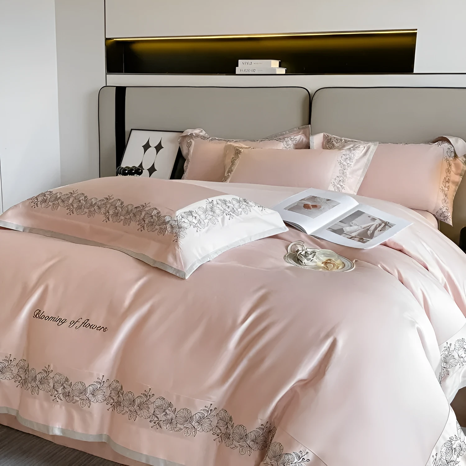 120 thread count pure cotton embroidered four-piece bedding set in solid grey colour on a bed