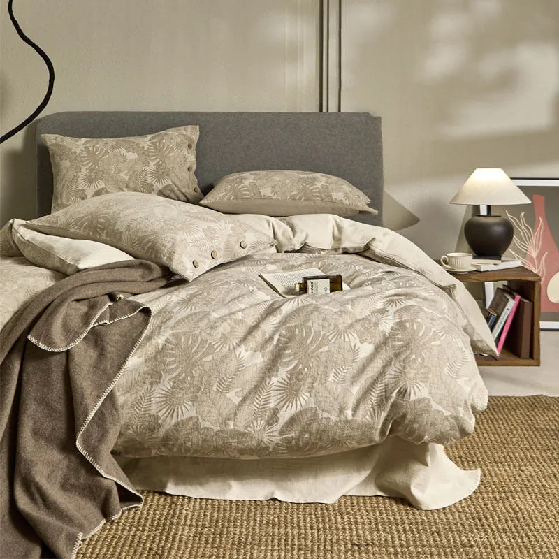 Linen cotton blend jacquard floral bedding four-piece set on a 1.5m double bed with quilt cover and pillowcases in neutral colours