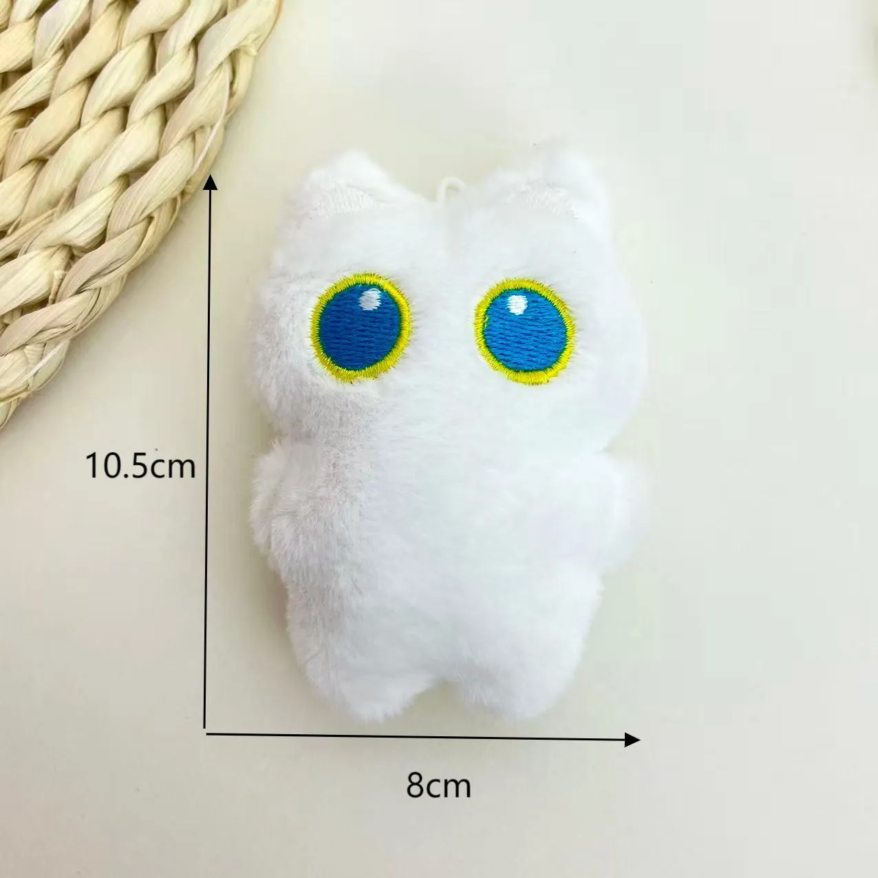 Cartoon big eye black cat doll plush with bead necklace as key decoration on a bag