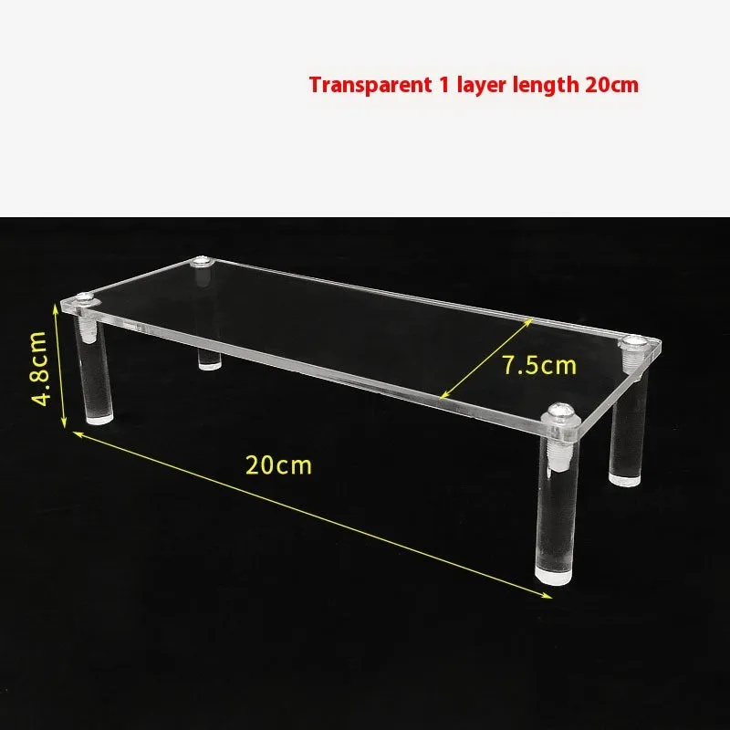 Transparent acrylic ladder display rack with three trapezoidal tiers showing blind box figurines on a desk