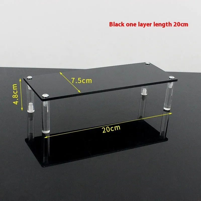 Transparent acrylic ladder display rack with three trapezoidal tiers showing blind box figurines on a desk