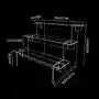 Transparent acrylic cosmetics storage rack with detachable shelves, displaying perfume bottles and small accessories