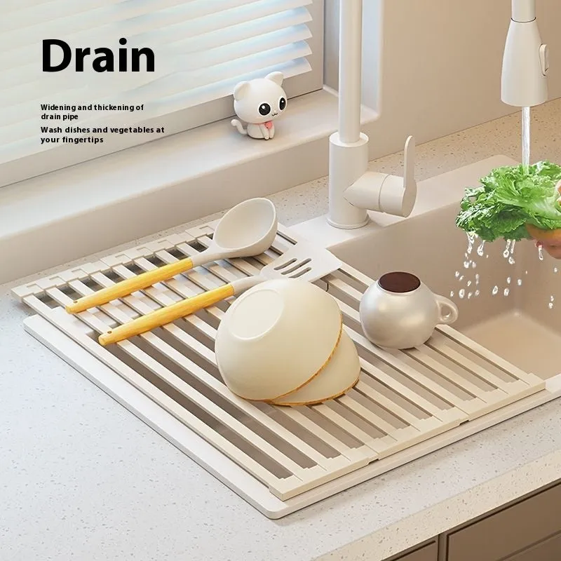 Milky white foldable stainless steel kitchen draining rack showing tri-fold mechanism