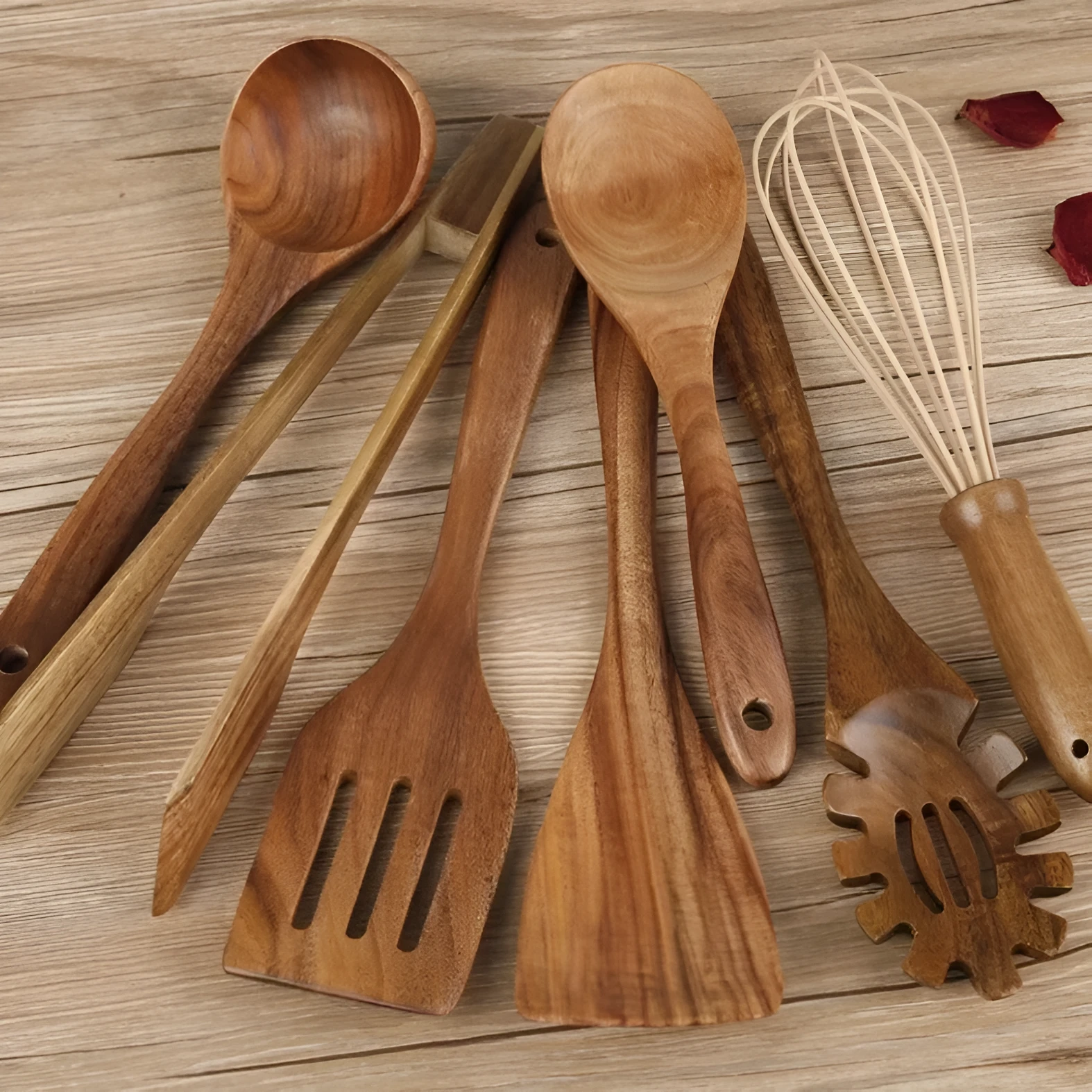 Natural wood 7-piece cooking utensil set for non-stick pans on a kitchen counter.