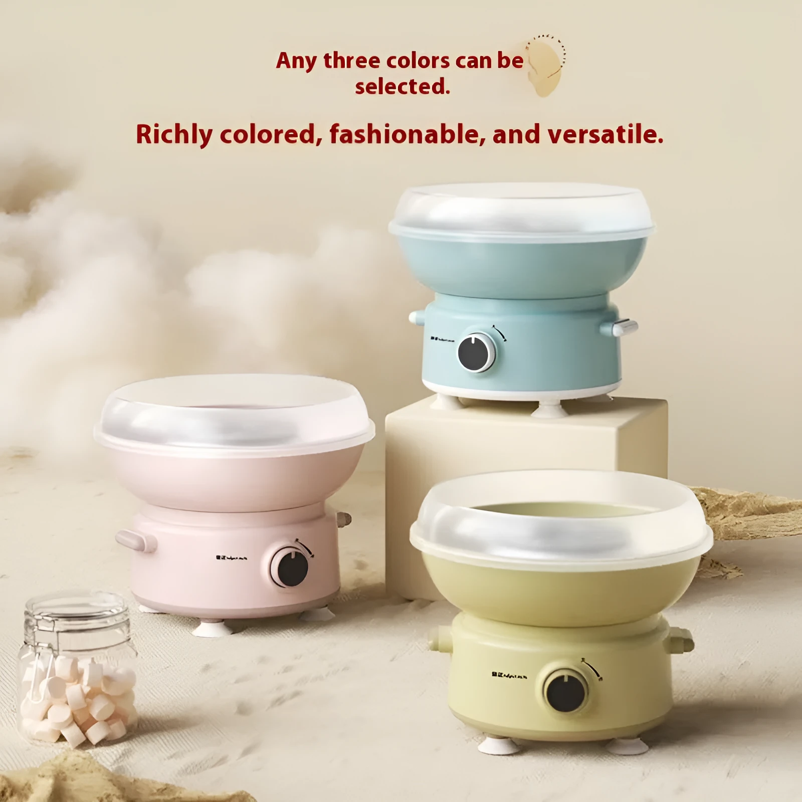 Mini cotton candy machine in blue with metal body and round heating tube on a countertop