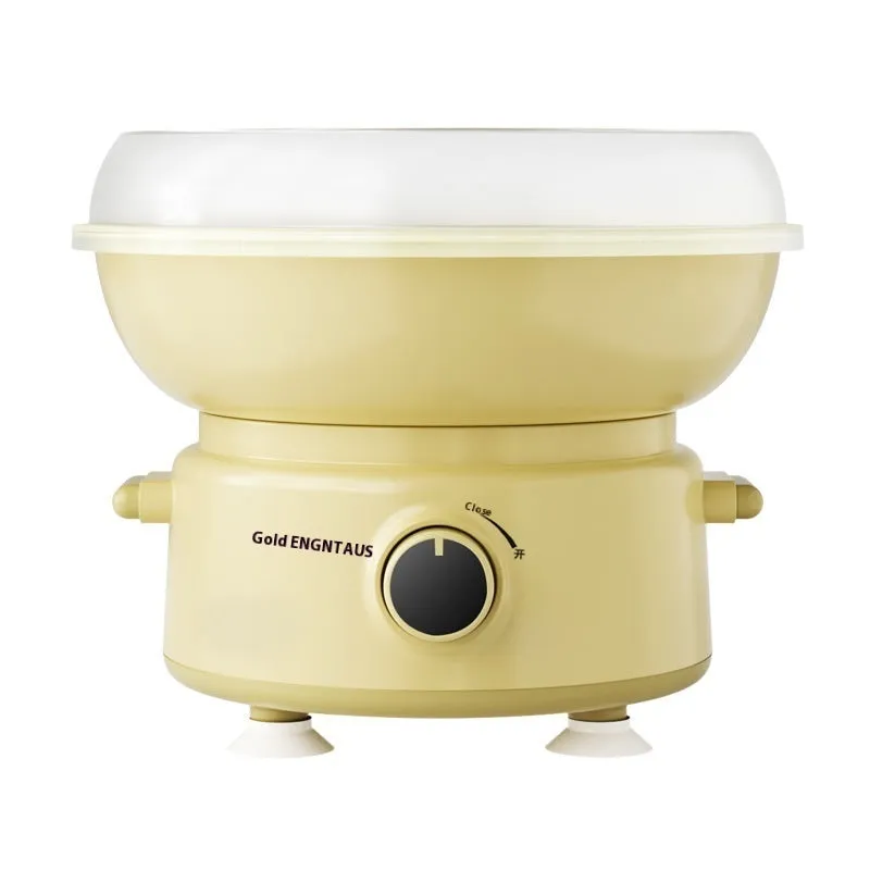 Mini cotton candy machine in blue with metal body and round heating tube on a countertop