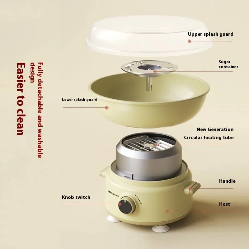 Mini cotton candy machine in blue with metal body and round heating tube on a countertop