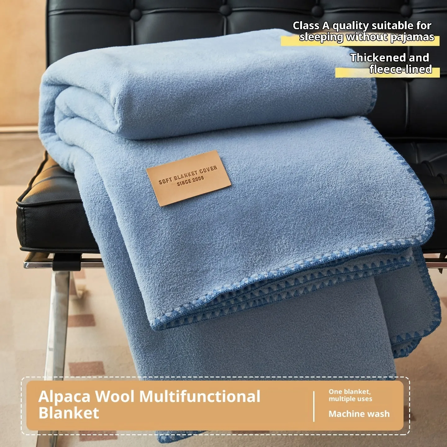 Class A Alpaca Fleecefiber blanket in solid colour, folded on a sofa, showing soft polyester texture