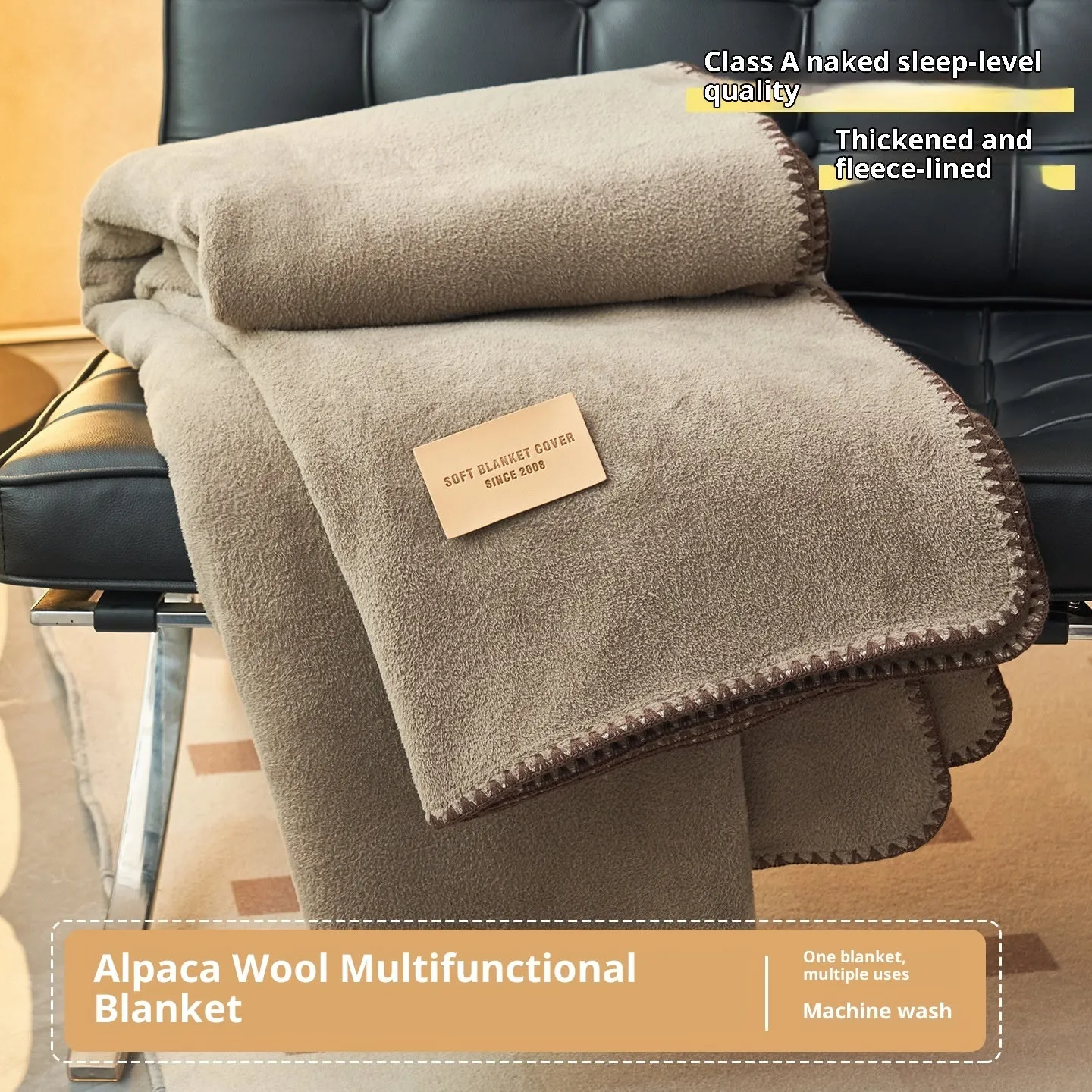 Class A Alpaca Fleecefiber blanket in solid colour, folded on a sofa, showing soft polyester texture