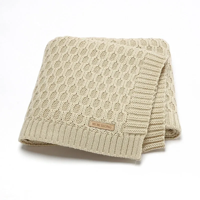Solid colour acrylic infant hug blanket in light green, showing three-dimensional line texture.