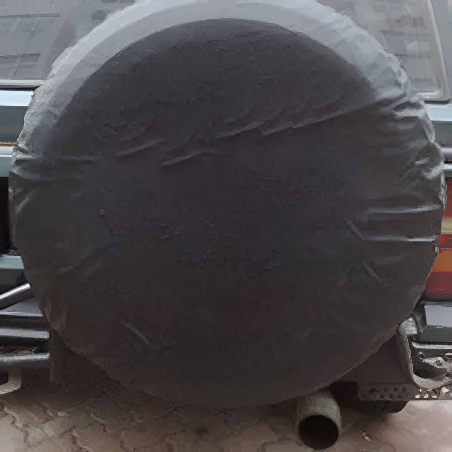 Pure black PVC faux leather spare tyre bag on a 16 inch car wheel