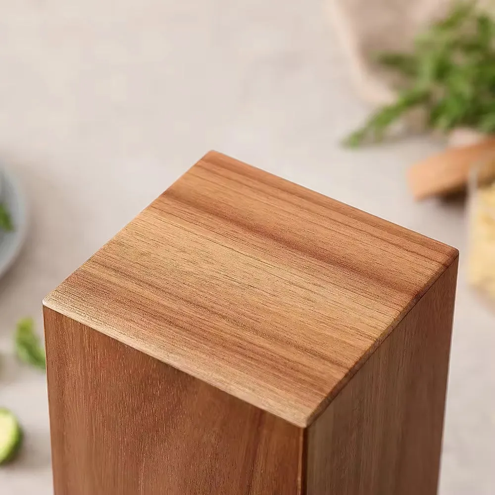 Xiangsi Wood Rotating Knife Holder in brown acacia wood with four strong magnetic sides on a kitchen countertop