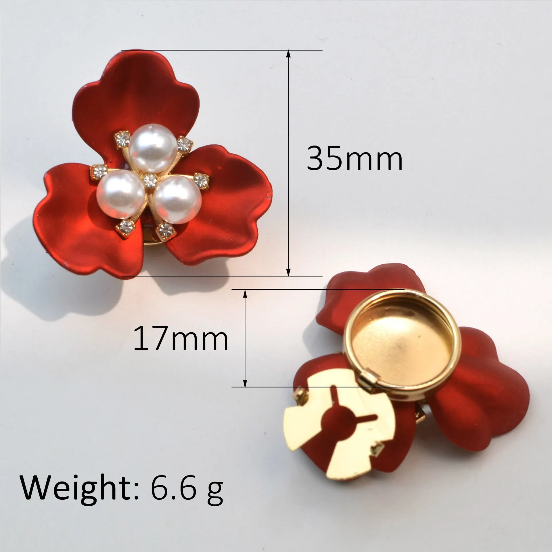 Metal cufflinks with pearl three-flap design in gold, pink, red, and white colours on white background
