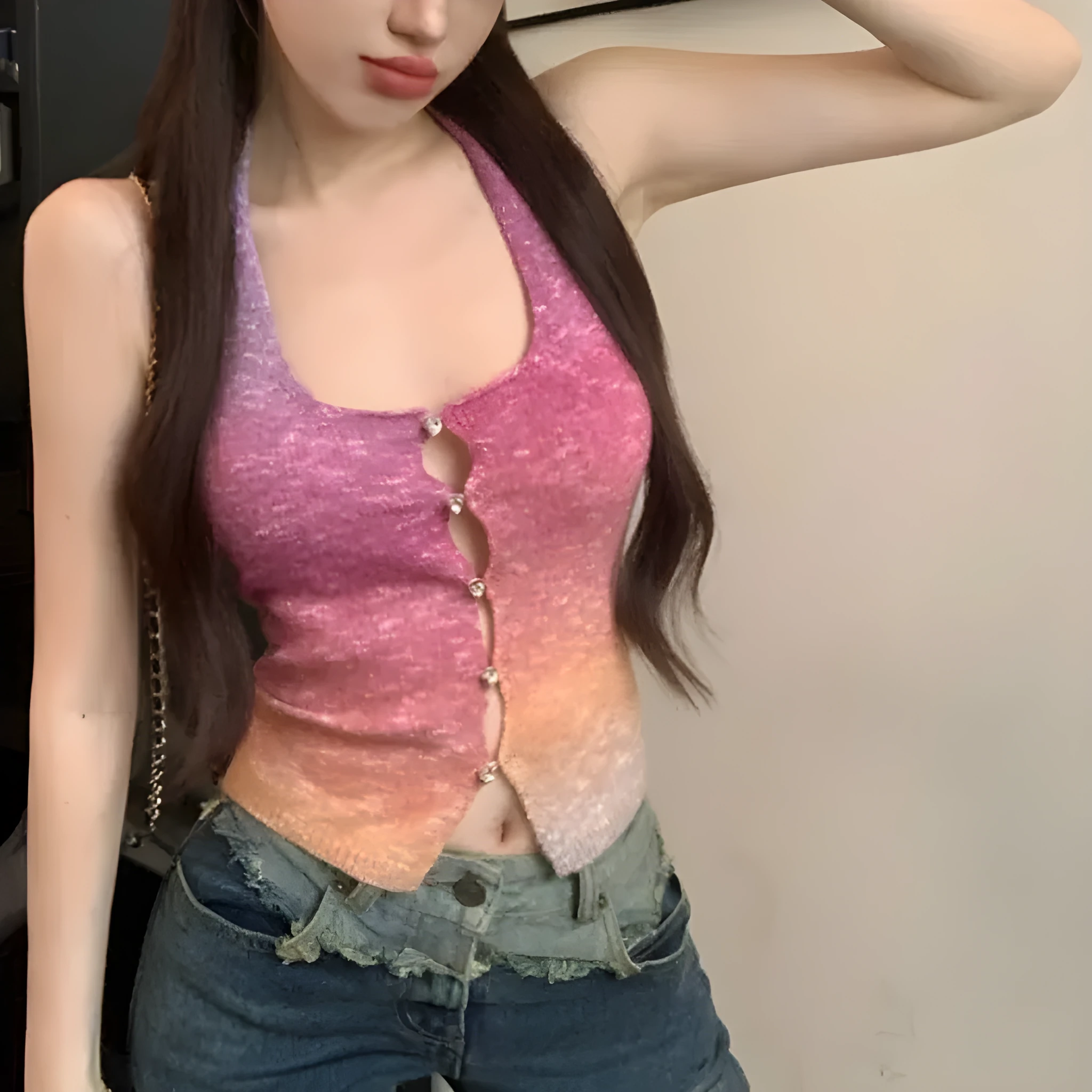 Pink knitted halter-neck vest with sweet colourful pattern on white background, front view