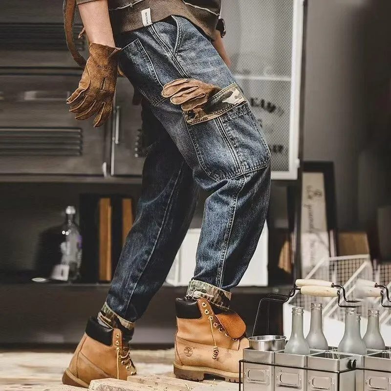 Men's loose blue denim cargo jeans with heavy distressed finish, mid waist, button fly