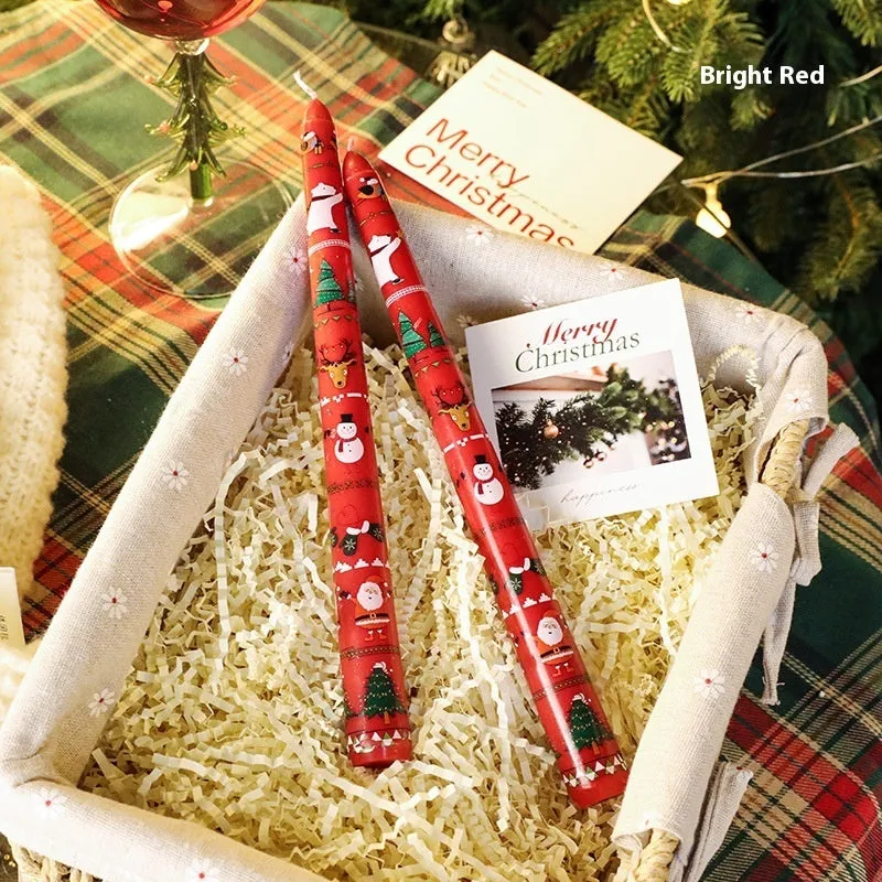 Cylindrical Christmas printed paraffin candle in bright red, 2.2 x 25 cm, on a wooden table