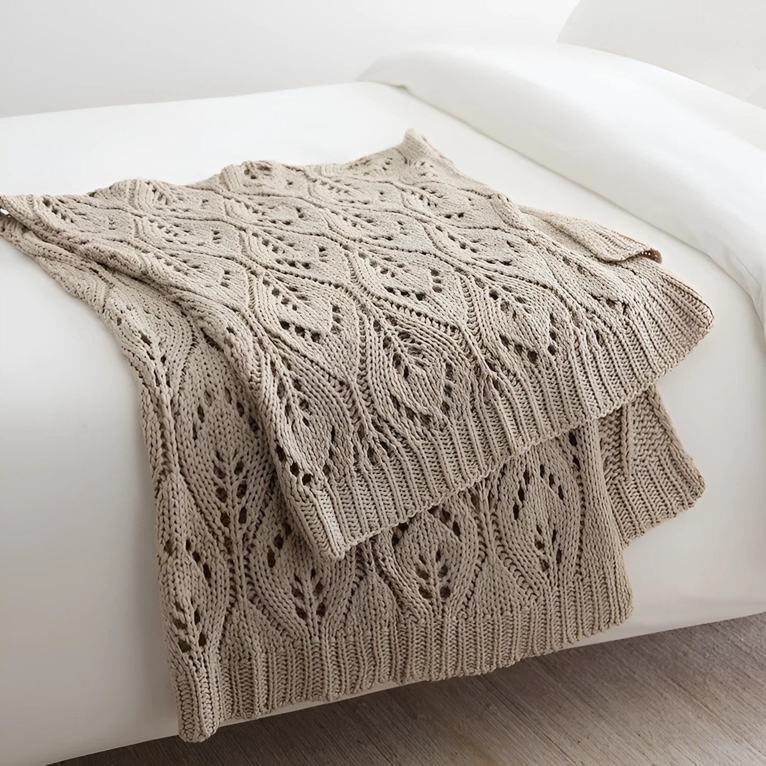 Nordic style knitted acrylic throw blanket 127x152cm in milky white on a sofa
