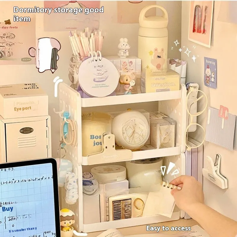 Beige plastic desktop wire-wrap board storage rack with three layers, two pen containers, and six hooks on a desk