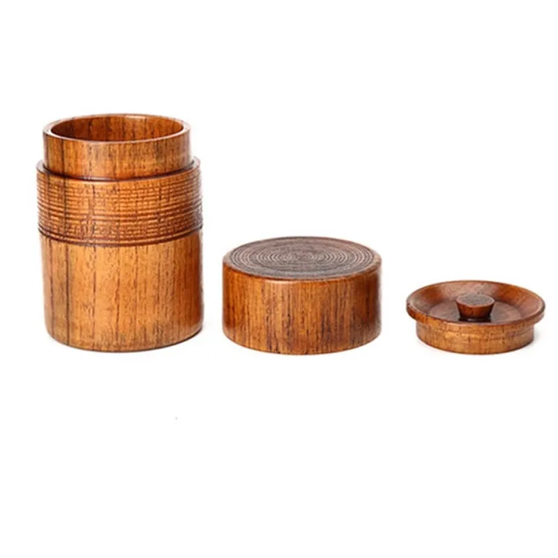 Hand-painted jujube wood sealed tea container with 200ml capacity on a wooden surface