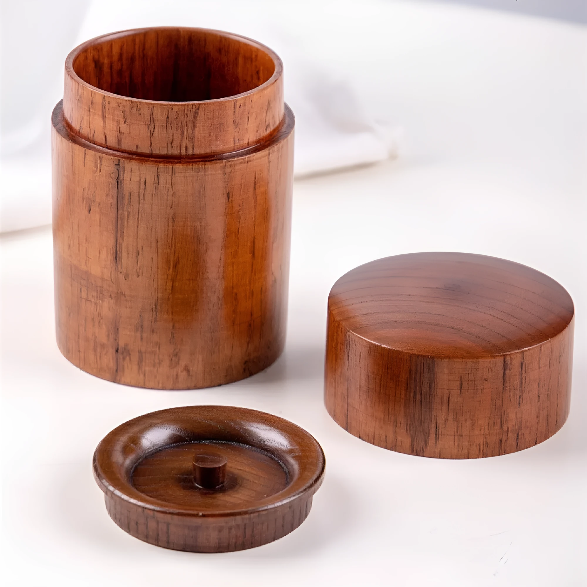 Hand-painted jujube wood sealed tea container with 200ml capacity on a wooden surface
