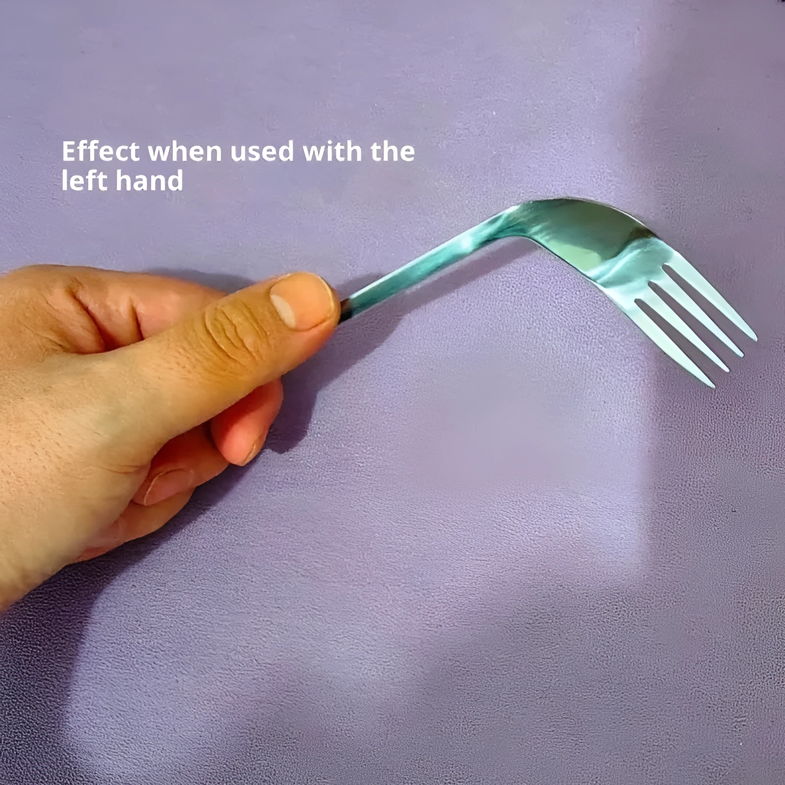 Stainless steel adaptive spoon for elderly feeding care, left hand version on white background