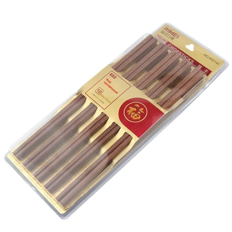 10 pairs of solid colour bamboo chopsticks on a plain surface, household kitchen use