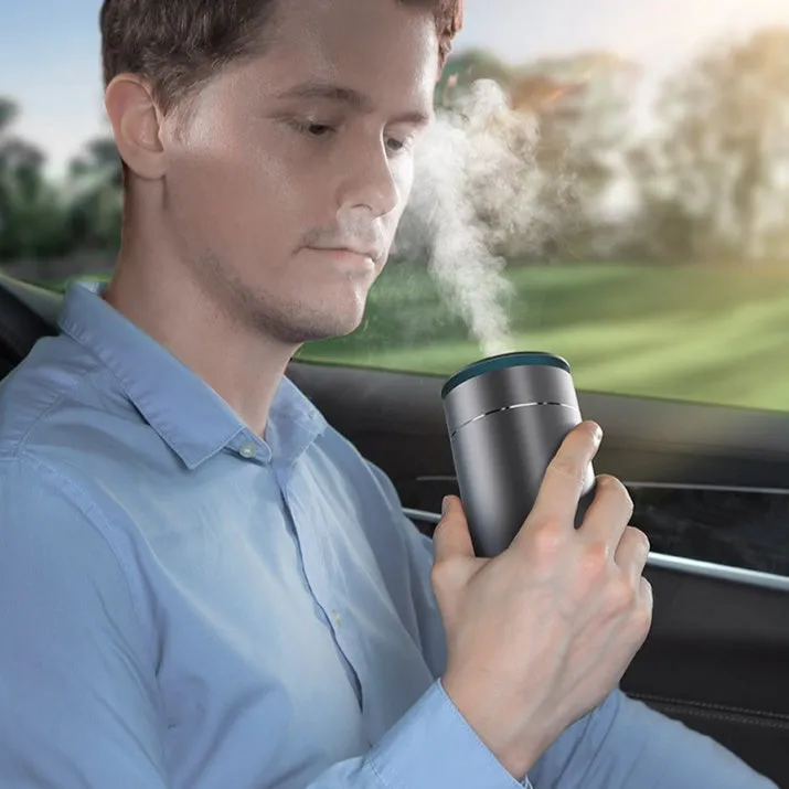 Mini car heavy fog aromatherapy humidifier in dark grey column shape with USB cable