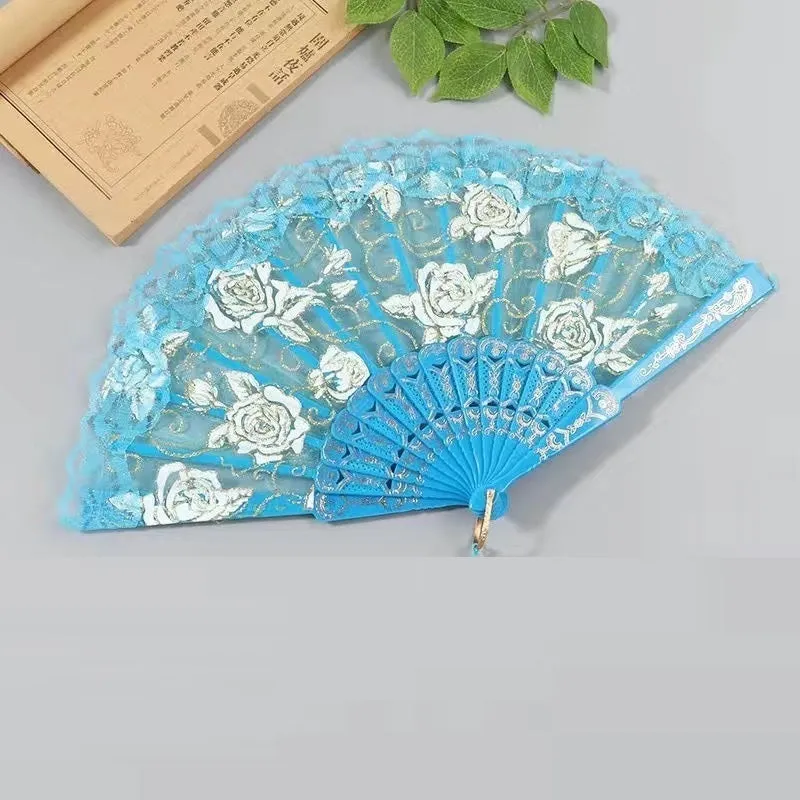 Plastic rose lace folding fan in red with tassel on white background