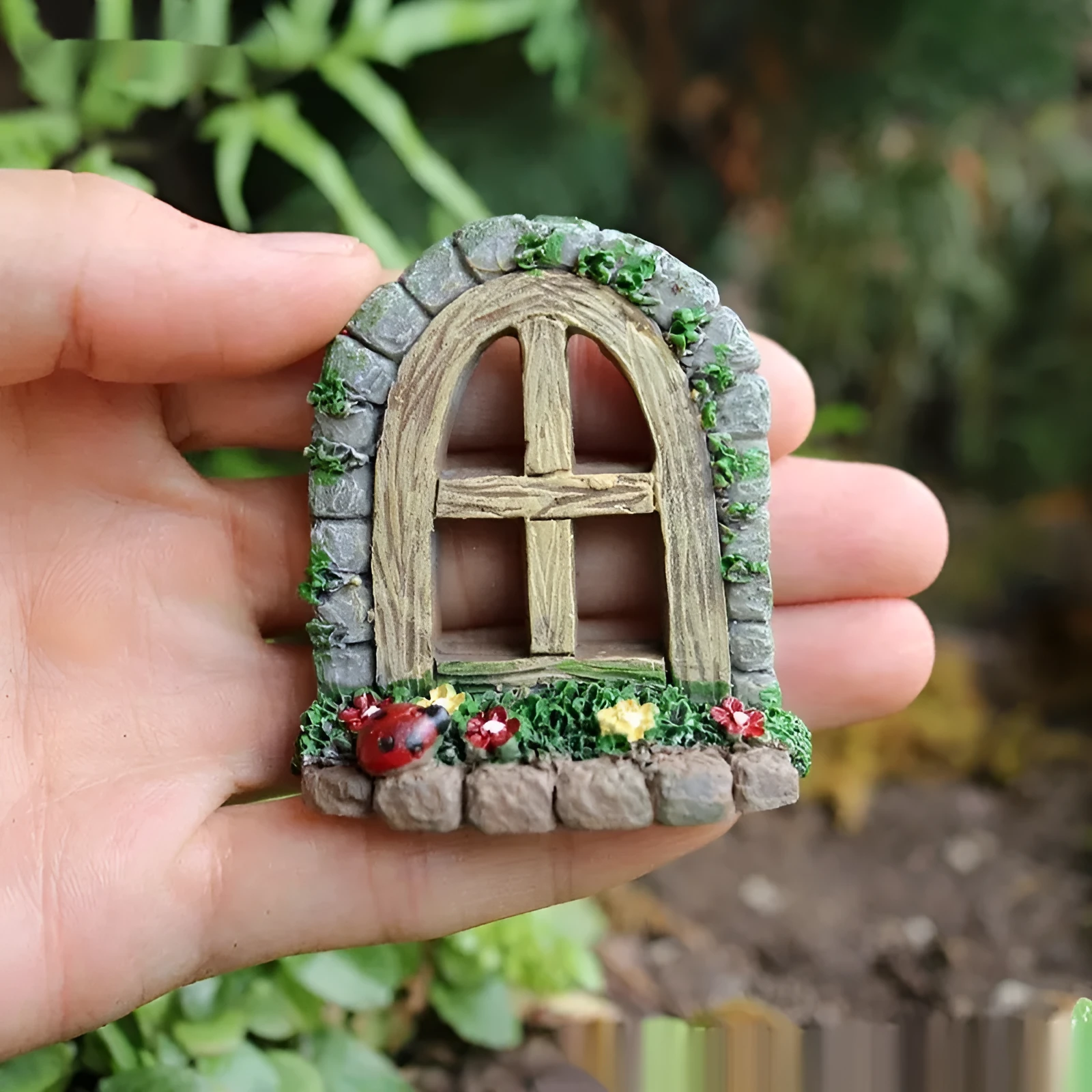 Single retro-style resin fairy garden ornament on a shelf, synthetic resin material, natural indoor lighting
