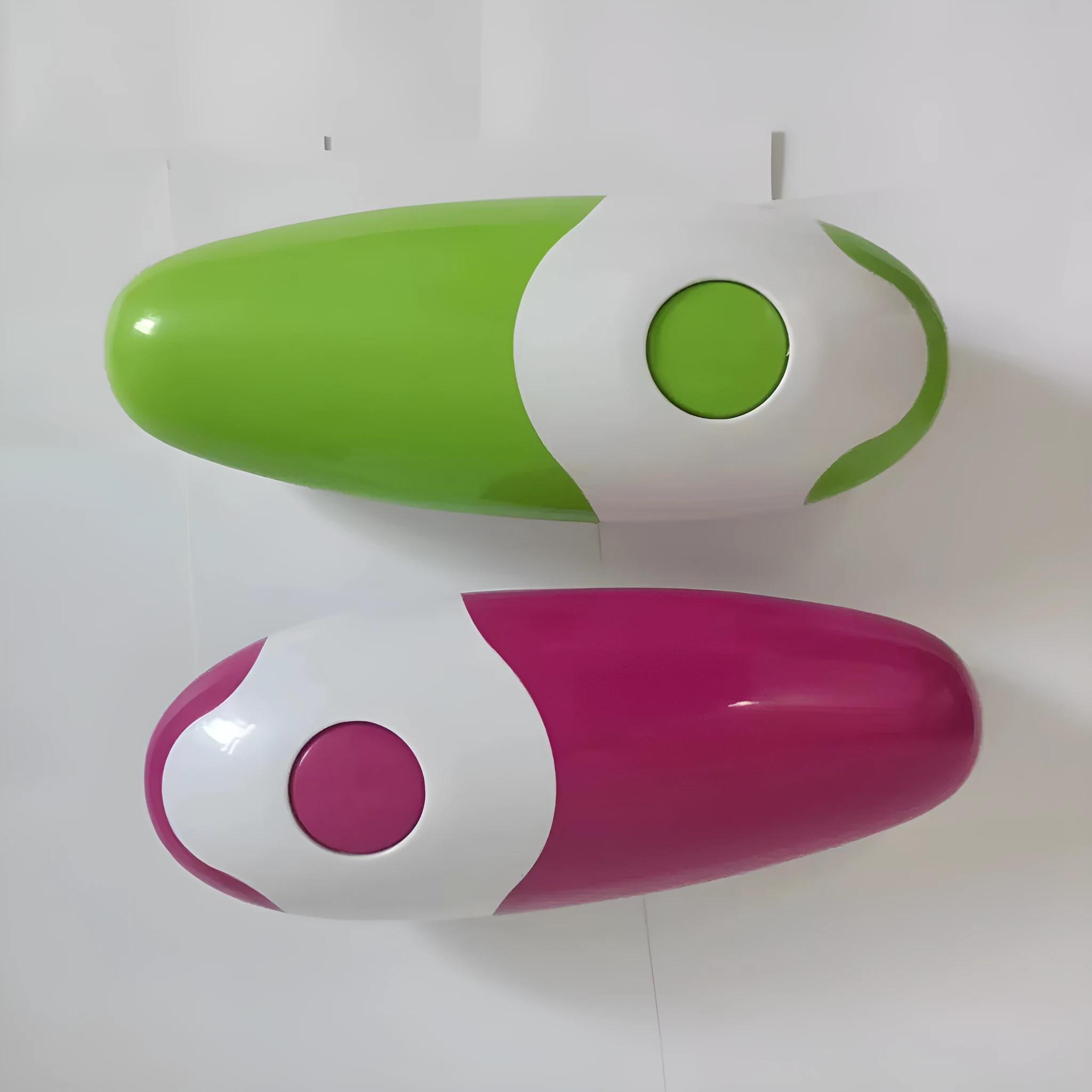 Electric can opener in light green plastic with iron box mechanism, 16x6.5x4.8cm, on kitchen countertop