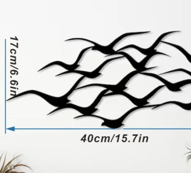 Metal flying bird wall decoration with seagull finish on a white wall