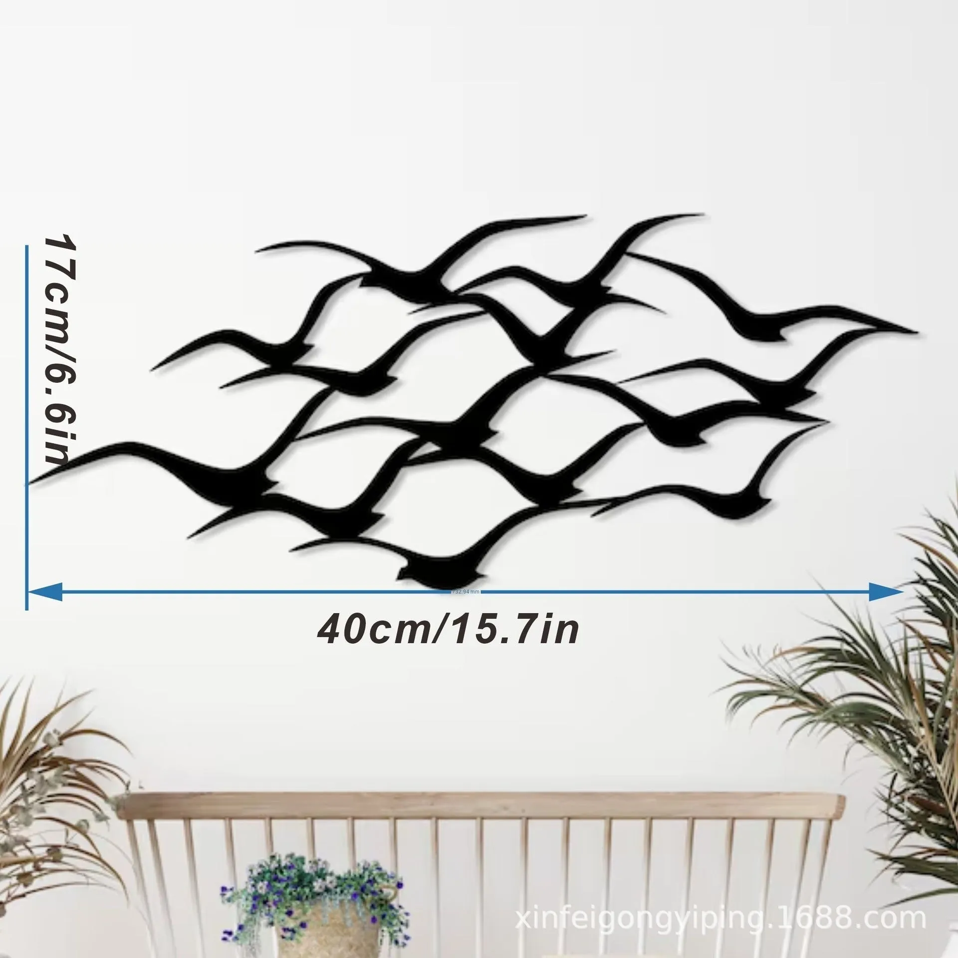 Metal flying bird wall decoration with seagull finish on a white wall