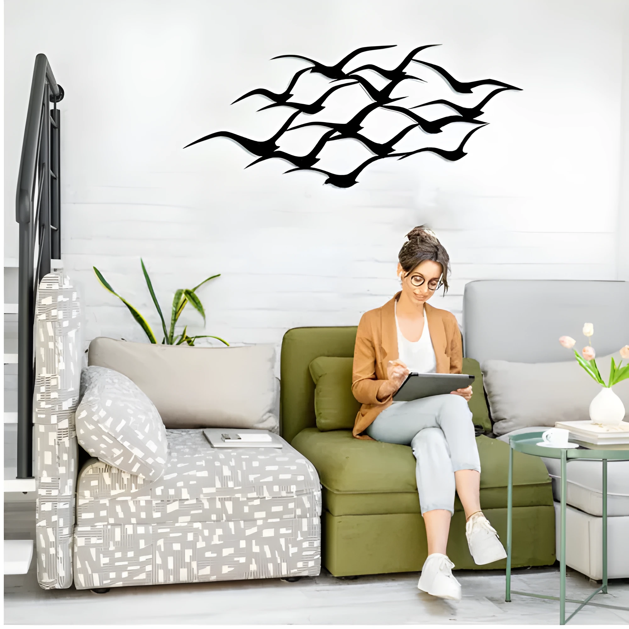 Metal flying bird wall decoration with seagull finish on a white wall