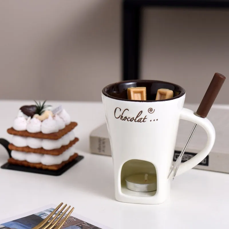 Ceramic binaural hot pot cup in brown for melting chocolate with fork and candle beside it