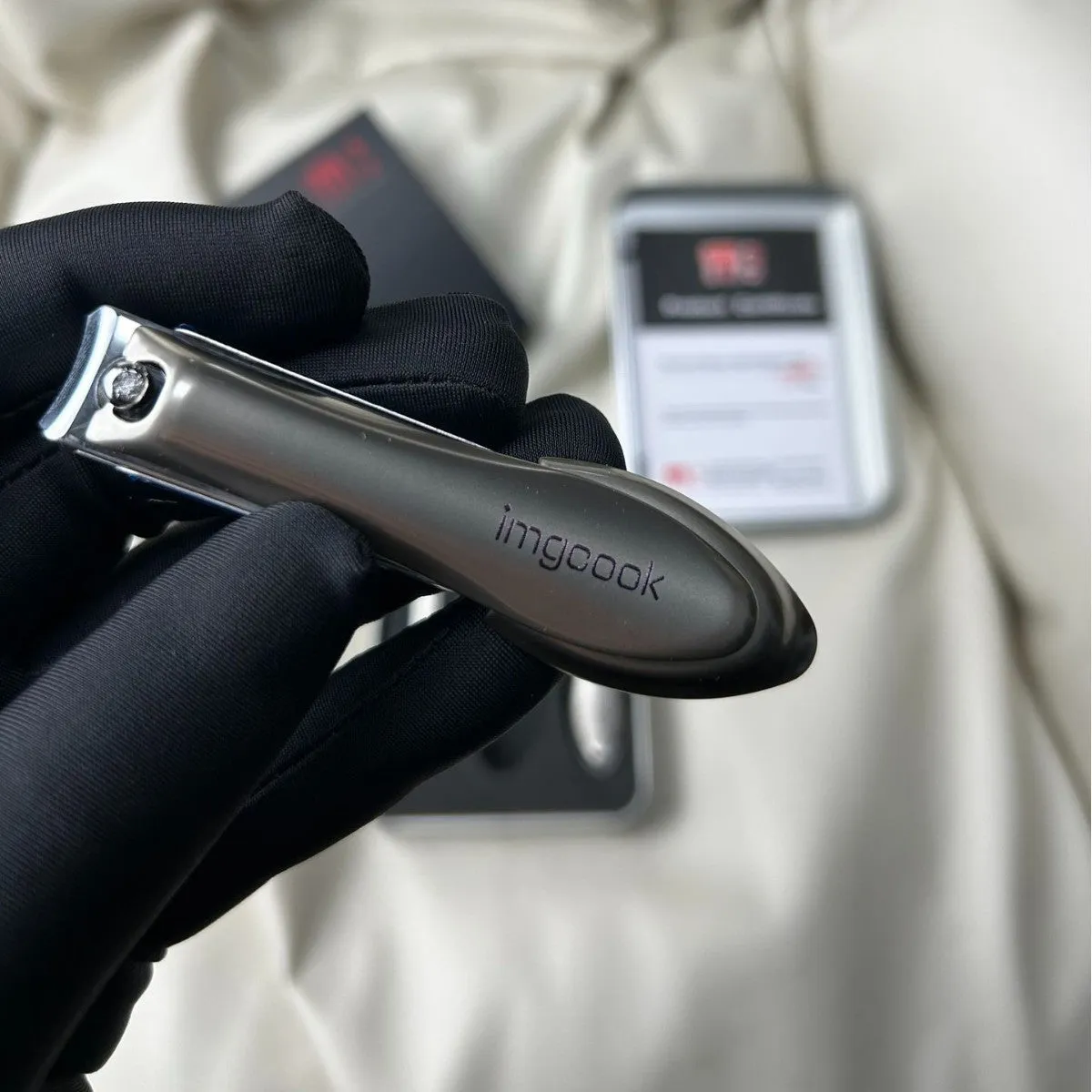 Three-piece anti-splash nail clippers set in black colour made from alloy and stainless steel