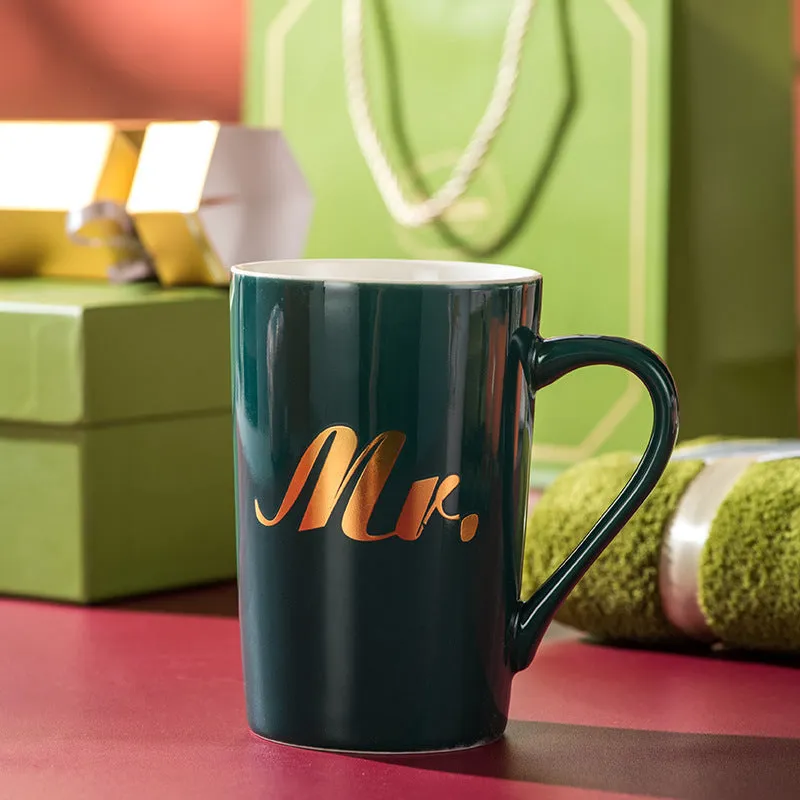 Light luxury ceramic cup gift box set with pink mug, candy, and towel on display